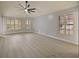 Large living room featuring hardwood floors and plantation shutters at 240 Shady Oaks Cir, Lake Mary, FL 32746