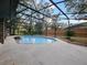 Refreshing screened pool with brick coping and covered patio at 240 Shady Oaks Cir, Lake Mary, FL 32746