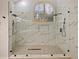 Large walk-in shower with marble tile and dual shower heads at 240 Shady Oaks Cir, Lake Mary, FL 32746