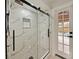 Elegant shower with marble tile and glass enclosure at 240 Shady Oaks Cir, Lake Mary, FL 32746