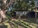 Partially fenced backyard with shed and large tree at 2429 S Elm Ave, Sanford, FL 32771