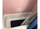 Bathroom with tub, shower, and pink tile at 2429 S Elm Ave, Sanford, FL 32771