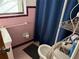 Retro bathroom with pink tile, and a toilet at 2429 S Elm Ave, Sanford, FL 32771