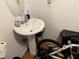 Clean bathroom with pedestal sink and shower at 2429 S Elm Ave, Sanford, FL 32771