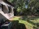 Side view of house exterior with AC unit and grassy yard at 2429 S Elm Ave, Sanford, FL 32771