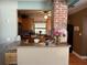 Kitchen features a breakfast bar and exposed brick wall at 2429 S Elm Ave, Sanford, FL 32771