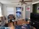 Living room with brown couch and wood floors at 2429 S Elm Ave, Sanford, FL 32771