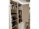 White pantry with adjustable shelves at 2429 S Elm Ave, Sanford, FL 32771