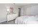 Bedroom with white dresser and a canopy bed in soft pink and white at 2436 Belle Haven Way, Davenport, FL 33896