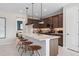 Modern kitchen with island, stainless steel appliances, and hardwood floors at 2436 Belle Haven Way, Davenport, FL 33896