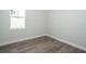 Empty bedroom with grey flooring and neutral colored walls at 2706 Alamo Dr, Orlando, FL 32805