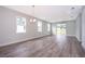 Bright and airy living area with lots of natural light and grey flooring at 2706 Alamo Dr, Orlando, FL 32805