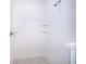 Clean shower with glass shelves and hexagonal floor tiles at 2706 Alamo Dr, Orlando, FL 32805