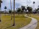 Park with walking path and palm trees at 2845 Oak Lea Dr, South Daytona, FL 32119