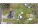 Aerial view of property showing home, large yard, and outbuildings at 3662 Mohawk Dr, Mount Dora, FL 32757