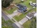 Aerial view of two houses with driveways and a street at 3662 Mohawk Dr, Mount Dora, FL 32757