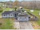 Aerial view of a house with solar panels and a large yard at 3662 Mohawk Dr, Mount Dora, FL 32757