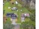 Aerial view of two houses with large yards and outbuildings at 3662 Mohawk Dr, Mount Dora, FL 32757