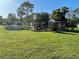 Large backyard with above ground pool and various garden features at 3662 Mohawk Dr, Mount Dora, FL 32757