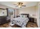 Bright bedroom with a ceiling fan and hardwood floors at 3662 Mohawk Dr, Mount Dora, FL 32757