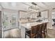 Updated kitchen featuring white cabinets and a kitchen island at 3662 Mohawk Dr, Mount Dora, FL 32757