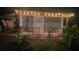 Covered patio with string lights and festive decorations at 3662 Mohawk Dr, Mount Dora, FL 32757