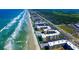 Aerial view showing oceanfront condo building and beach at 4175 S Atlantic Ave # 508, New Smyrna Beach, FL 32169