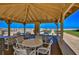 Relaxing gazebo with tables and chairs overlooking the ocean at 4175 S Atlantic Ave # 508, New Smyrna Beach, FL 32169