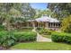 House exterior featuring a metal roof, landscaped grounds, and walkway at 451 Northwind Rd, Maitland, FL 32751