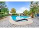 Relaxing pool with spa, patio, and lake views at 451 Northwind Rd, Maitland, FL 32751