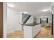 White kitchen island with seating and view of living area at 466 W Par St # 466, Orlando, FL 32804