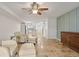 Living area with two armchairs and ottomans, view of kitchen at 466 W Par St # 466, Orlando, FL 32804