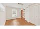 Bedroom with wood floors, built-in shelving and window at 4862 Indialantic Dr, Orlando, FL 32808