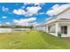 Backyard with patio and lake view at 5302 Royal Point Ave, Kissimmee, FL 34746