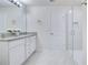 Modern bathroom with granite countertop, double sinks, and glass shower at 5302 Royal Point Ave, Kissimmee, FL 34746