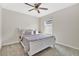 Cozy bedroom with a full-size bed and window at 5302 Royal Point Ave, Kissimmee, FL 34746