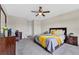 Bedroom with a queen-size bed and ensuite bath at 5302 Royal Point Ave, Kissimmee, FL 34746