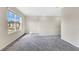 Spacious bedroom with carpeted floor and window at 5302 Royal Point Ave, Kissimmee, FL 34746