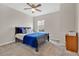 Bedroom with a full-size bed and dresser at 5302 Royal Point Ave, Kissimmee, FL 34746