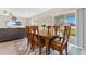 Bright dining room with wooden table and chairs at 5302 Royal Point Ave, Kissimmee, FL 34746