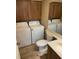 Bathroom with toilet, double vanity, and laundry at 5392 Elm Ct # 363, Orlando, FL 32811