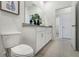 Modern bathroom with toilet and double vanity at 5513 Hanover Square Dr, St Cloud, FL 34771