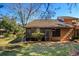 Back view of home with a screened in porch and mature landscaping at 596 Albany Pl, Longwood, FL 32779