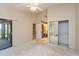 Airy bedroom leading to the walk-in closet and bathroom, featuring sliding door access to the screened porch at 596 Albany Pl, Longwood, FL 32779