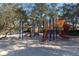 Community playground featuring a slide, climbing area, and sandy play surface for children at 596 Albany Pl, Longwood, FL 32779