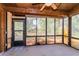 Enclosed screened porch with plenty of natural light, ceiling fan, and a view of the backyard at 596 Albany Pl, Longwood, FL 32779