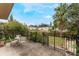 Private backyard patio with metal fence and table set at 602 Iris St, Altamonte Springs, FL 32714