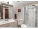 Bathroom with a single sink, toilet, and a large walk-in shower at 602 Iris St, Altamonte Springs, FL 32714