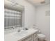 Clean bathroom with a shower/tub combo and updated vanity at 602 Iris St, Altamonte Springs, FL 32714