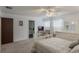 Bedroom with a white bed frame, dresser, ceiling fan and en-suite bathroom at 602 Iris St, Altamonte Springs, FL 32714